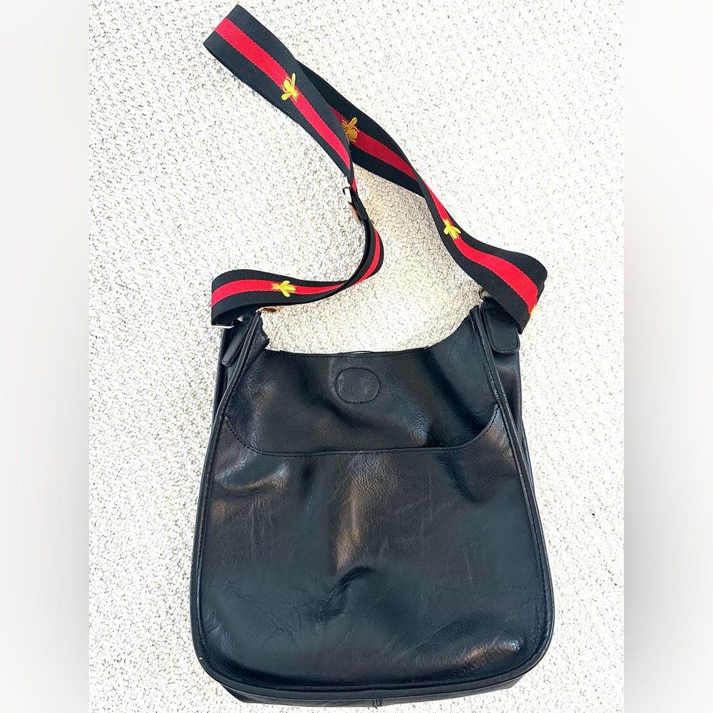 Ah-dorned black leather crossbody bag with 2 straps